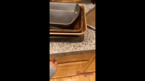 a swirl cookie sits in a drawer next to a person 's hand and the words xedgea
