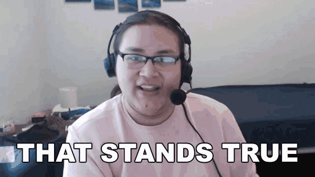 a man wearing headphones and glasses says " that stands true "