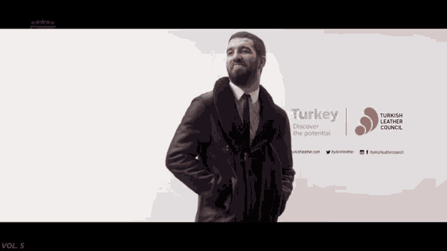 a man in a suit and tie is standing in front of a turkey advertisement