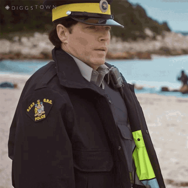 a man in a police uniform with the word police on his sleeve