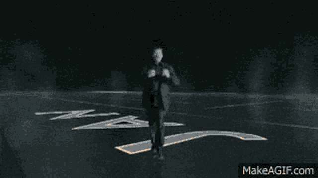 a silhouette of a man standing in front of a fireball with the words " neil with it " above him