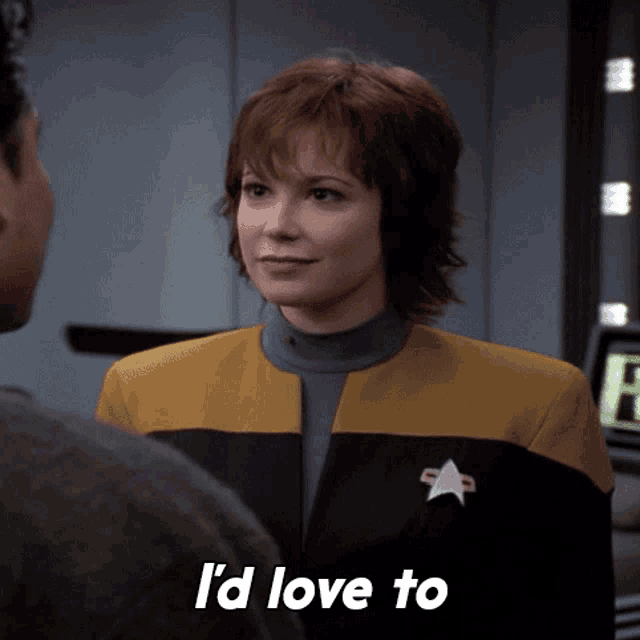 a woman in a star trek uniform says i 'd love to in white letters