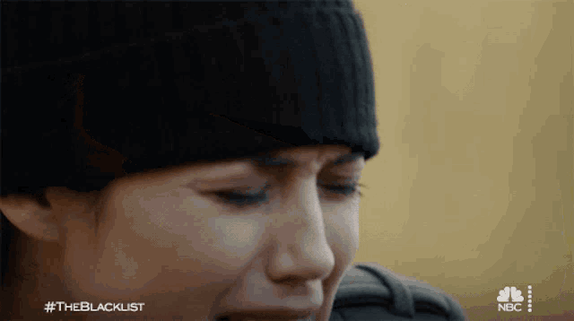 a close up of a woman 's face with the hashtag #theblacklist on the bottom