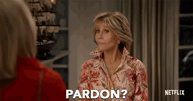a woman in a floral shirt says " pardon "