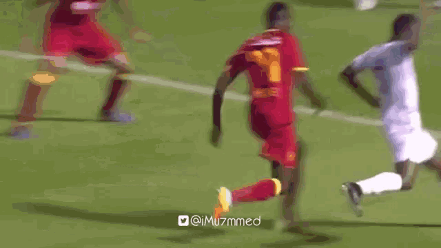 a soccer player with the number 8 on his jersey is jumping in the air