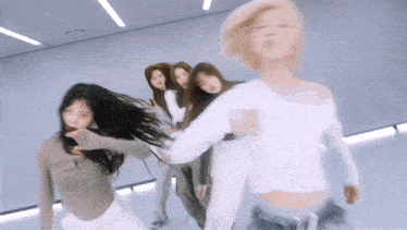 a blurry picture of a group of women dancing