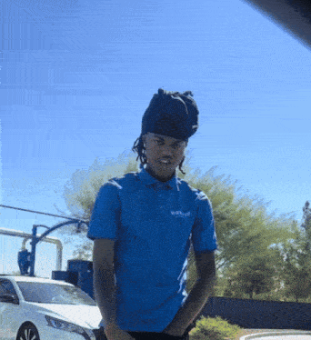 a man wearing a blue shirt that says ' busch ' on it