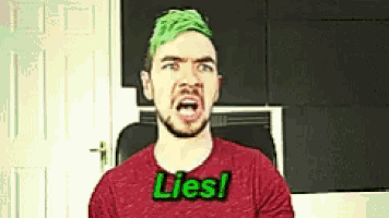 a man with green hair is wearing a shirt that says lies .