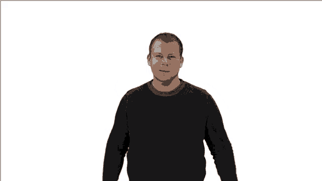 a man in a black sweater is making a fist