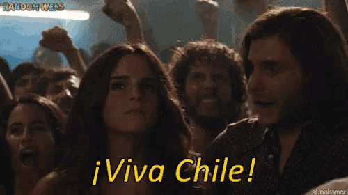 a woman in a crowd says viva chile in yellow