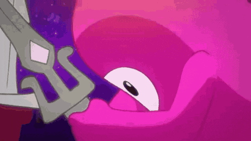 a close up of a person holding a sword in their mouth .