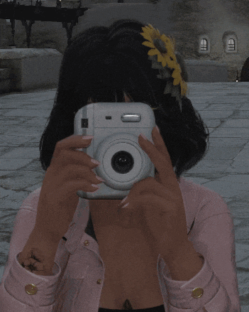 a woman in a pink jacket is taking a picture of herself with a camera