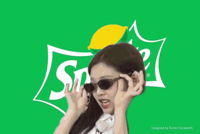 a woman is standing in front of a green sprite logo .