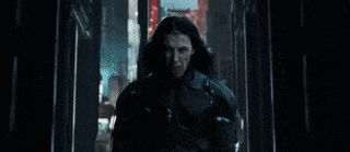 a man is holding a laser in his eyes .