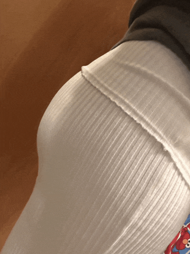 a close up of a person 's butt with a sesame street shirt on