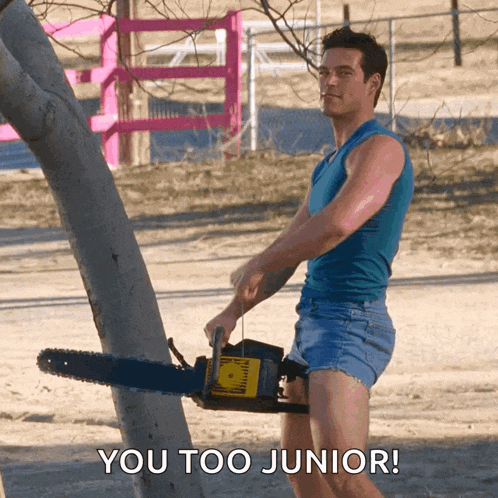 a man is holding a chainsaw with the words you too junior behind him