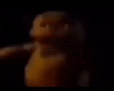 a close up of a yellow object in the dark