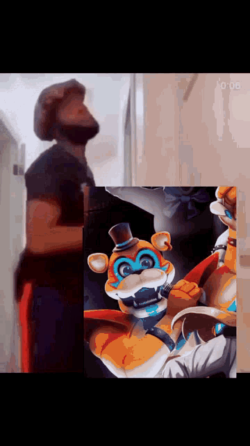 a man with a beard is standing next to a picture of a teddy bear with a top hat ..