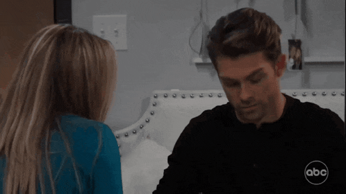 a man and a woman are looking at each other in a scene from a tv show called abc