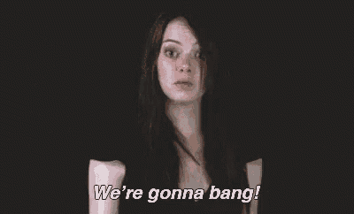 a woman is making a face and saying `` we 're gonna bang '' .