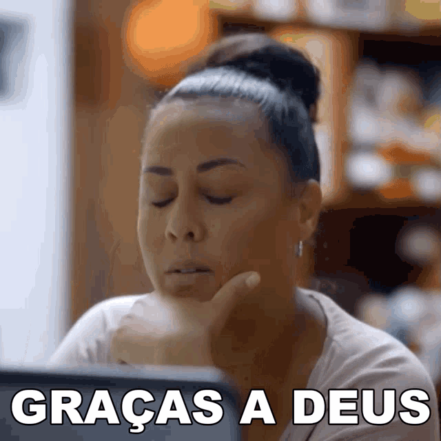a woman with her eyes closed has the words graças a deus on the bottom