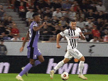 a soccer player in a purple jersey with the number 10 on it