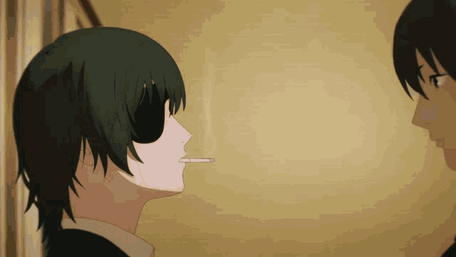 a man with green hair is smoking a cigarette in front of another man
