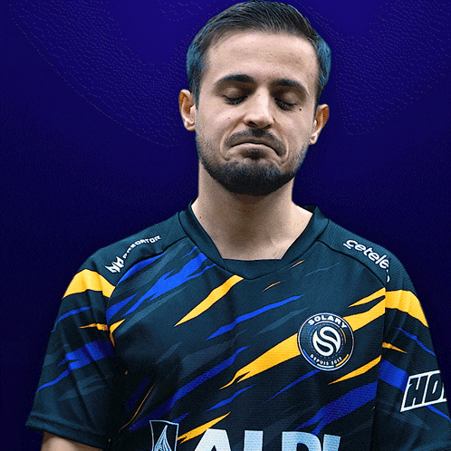 a man wearing a blue and yellow shirt with the word solaris on it