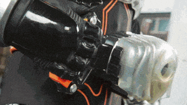 a close up of a person wearing a black and orange costume