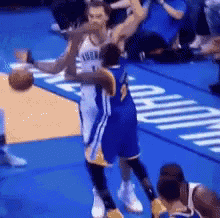 a basketball player with the number 1 on his jersey is dribbling the ball