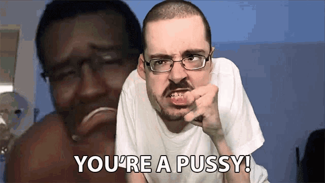a man with glasses says you 're a pussy in front of another man
