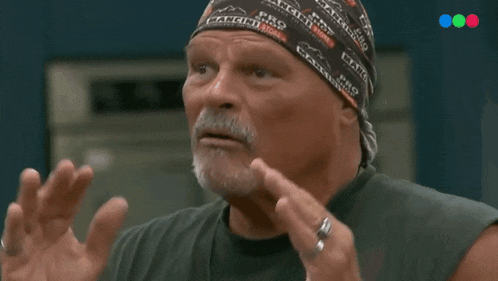 a man with a bandana on his head says tal cual in spanish