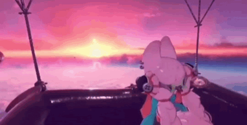 a pink cartoon character is sitting in a hot air balloon .