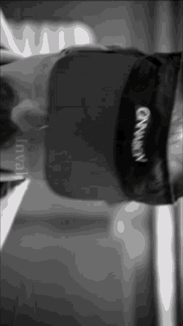 a black and white photo of a person wearing a hat that says gwyn on it
