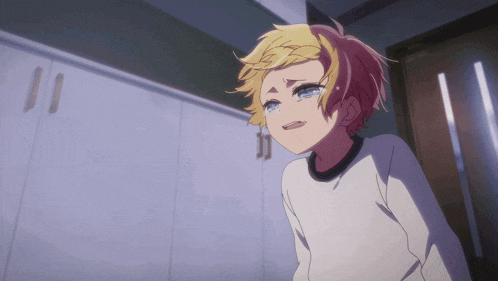 a young boy with blonde hair is crying in front of a door