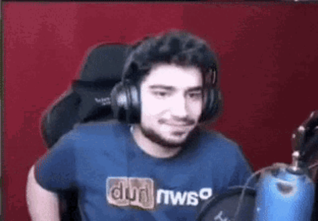a man wearing headphones and a shirt that says dwso