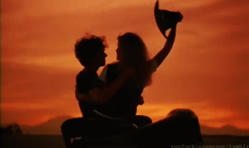 Riding Into The Sunset Cant Buy Me Love GIF - Riding Into The Sunset Cant Buy Me Love Kiss GIFs