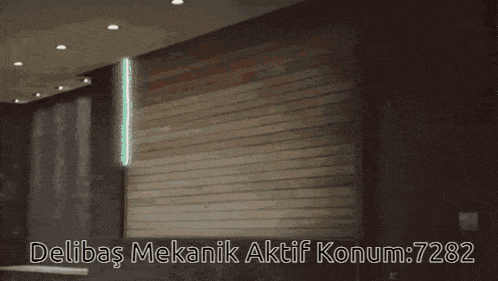 a car is parked in a garage with the words delibas mekanik aktif konum : 7282
