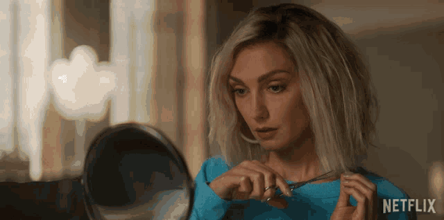 a woman is cutting her hair in front of a mirror with netflix written on the bottom