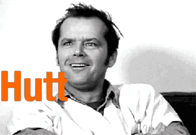 a black and white photo of a man with the word hutt behind him