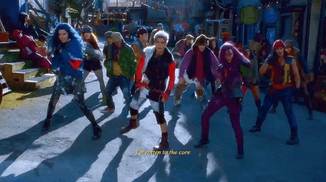 a group of people are dancing on a street with the words i 'm eation to the core on the bottom