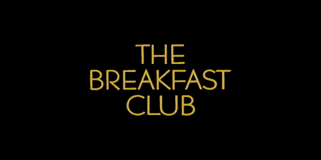a black background with the words " the breakfast club " in yellow