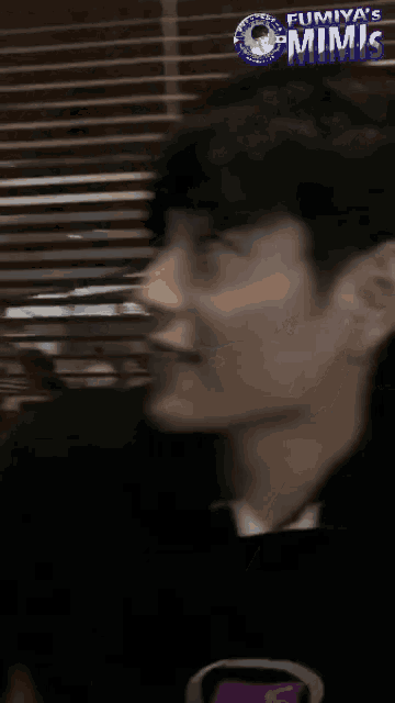 a close up of a person 's face with the words " fumiya 's mimic " on the top