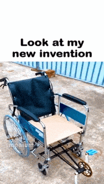 a blue and black wheelchair with a wooden seat is sitting on a concrete surface .