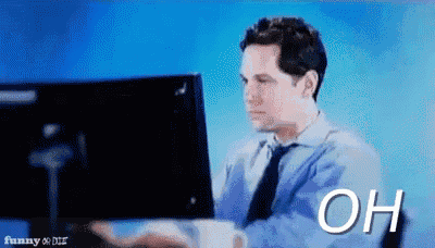 a man in a tie is typing on a computer and the word oh is on the screen