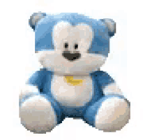 a blue and white teddy bear with a yellow collar is sitting on a white surface .