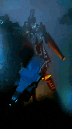 a robot is holding a torch that is glowing yellow