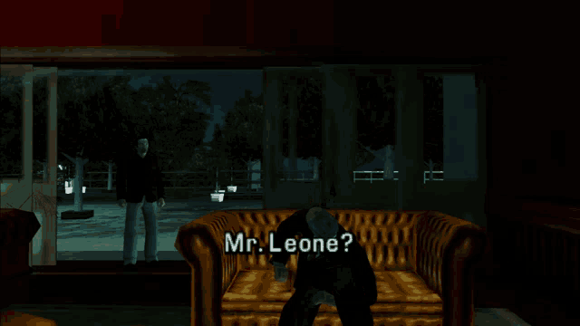 a man in a suit is standing in front of a couch with the words mr. leone written on it