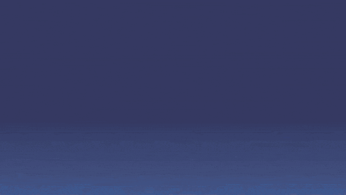 a blue and white whale is floating in the dark