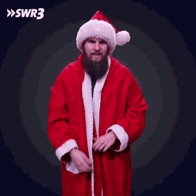 a man with a beard is dressed in a santa suit and hat with the letters swr3 above him